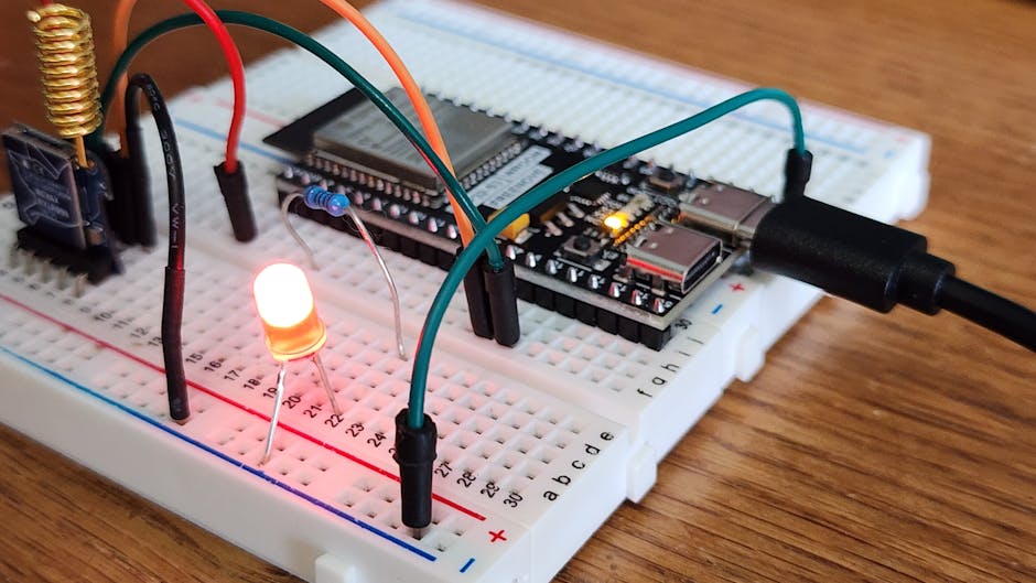 Breadboard with microcontroller, LED, and jumper wires